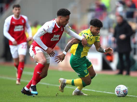 Rotherham United's Zak Vyner (left) and Norwich City's Jamal Lewis battle for the ball during the Sky Bet Championship match at the AESSEAL New York Stadium, Rotherham. Pic: Nigel French/PA Wire.