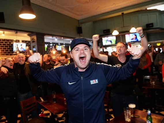 Blades fans celebrate in the Clubhouse, London Road after watching Leeds draw with Villa on TV at Sunday lunchtime confirming Sheffield United's promotion to the Premier League. Picture: Steve Ellis