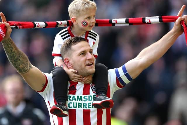 Sheffield United's Billy Sharp with his son after the final whistle against Ipswich Town on Saturday. Picture: Nick Potts/PA Wire
