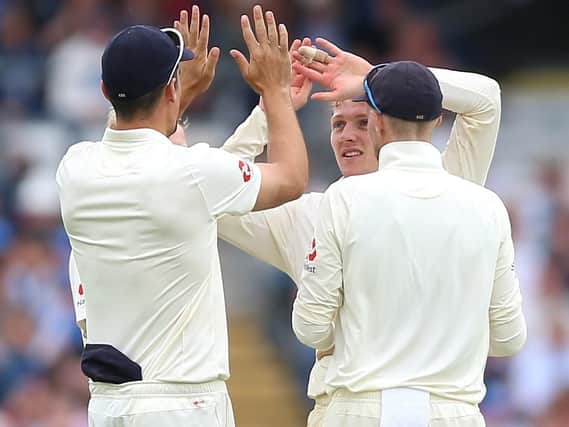 England Dom Bess (centre) celebrates after taking the wicket of Pakistan's Usman Salahuddin during a match at Headingley