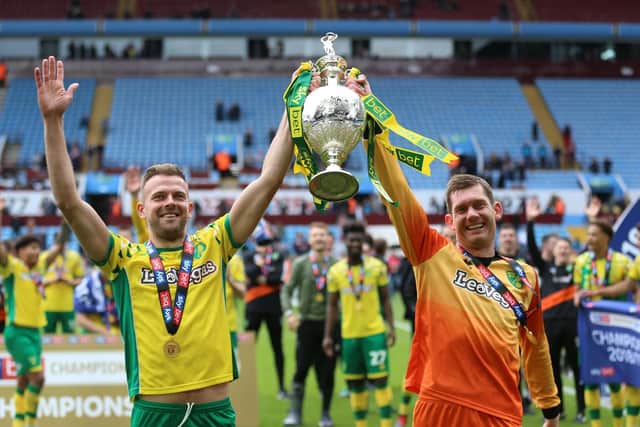 Norwich City's Jordan Rhodes and Michael McGovern celebrate Norwich City's promotion with the Championship title