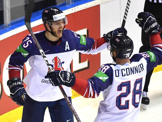 Great Britain's forward Robert Dowd, left, celebrates with defender Ben O'Connor