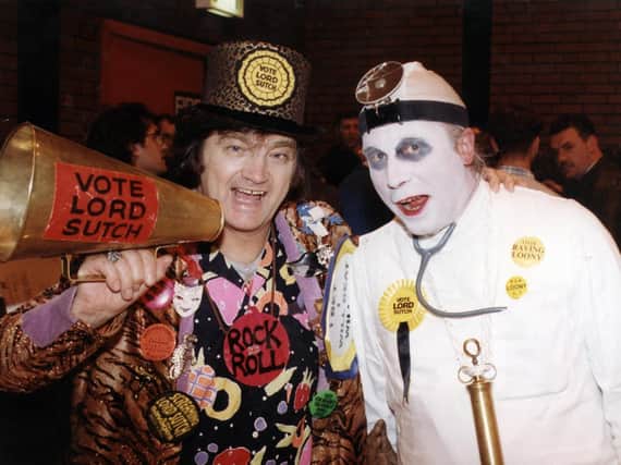 Screaming Lord Sutch and his election agent pictured at the count in February 1998
