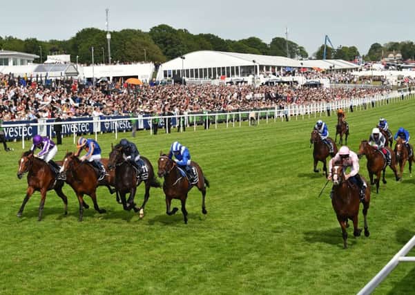 Five in a line as Anthony Van Dyck (nearside) pips four rivals to win Saturday's Investec Derby at Epsom. (PHOTO BY: Glyn Kirk/Getty Images).
