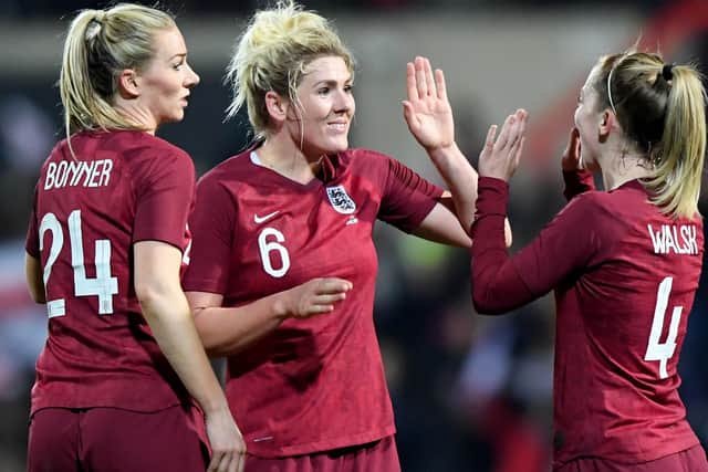 Gemma Bonner, Millie Bright and Kiera Walsh of England celebrate victory.