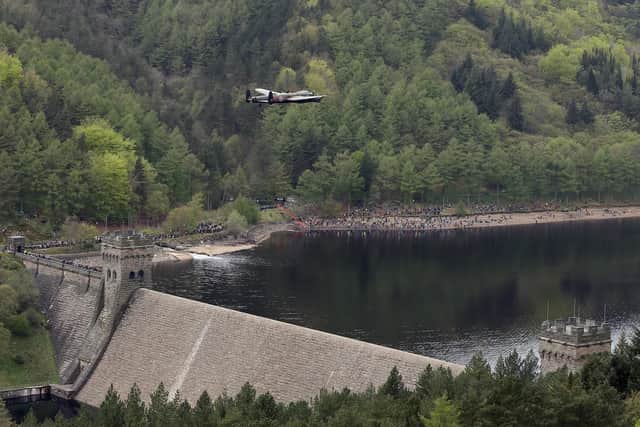 A Lancaster bomber flies over Ladybower reservoir (Photo by Christopher Furlong/Getty Images)