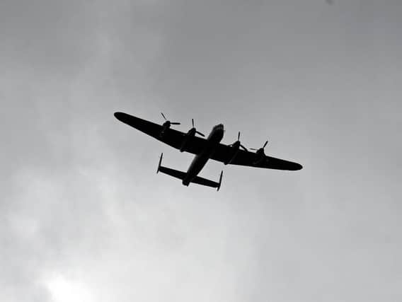 Lancaster Bomber makes a flypast during the service. Picture: Marie Caley NSST-13-06-19-D-Day75Drumheadservice-30