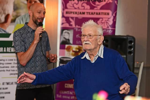 Entertainer Russ Elliott, pictured with attendee Patrick Hart.  Picture: Marie Caley NSST-19-06-19-MemoriesOfFriends-2