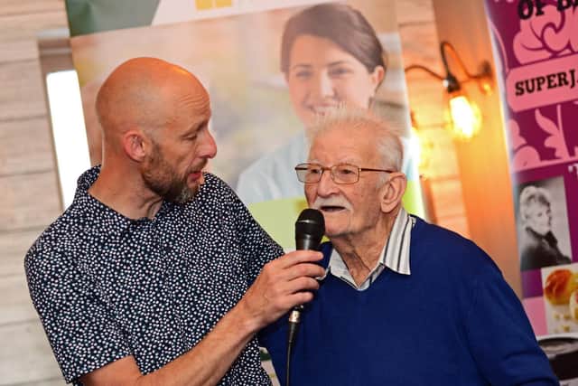 Entertainer Russ Elliott, pictured with attendee Patrick Hart.  Picture: Marie Caley NSST-19-06-19-MemoriesOfFriends-4