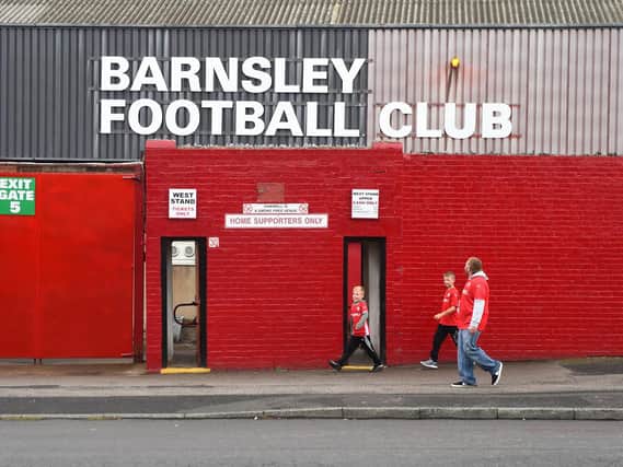 Barnsley fans make their way to Oakwell Stadium (Photo by Nathan Stirk/Getty Images)