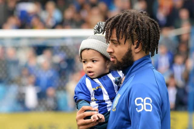Sheffield Wednesday loanee Michael Hector with his young son Zacharia