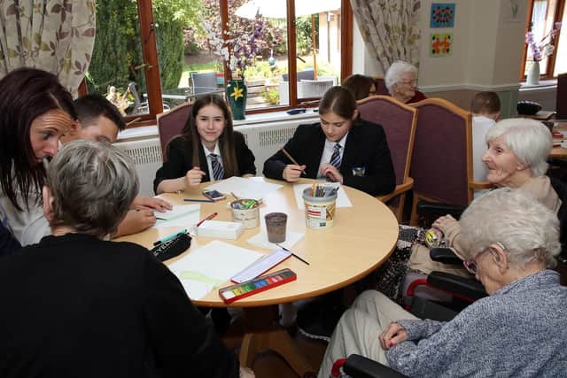 Pupils from Wales High School visit and spend time with some of the residents at Ladyfield House (Photo: Glenn Ashley)