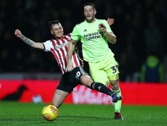 Conor Washington of Sheffield United is fouled by Josh McEachran of Brentford (Photo by Dan Istitene/Getty Images)