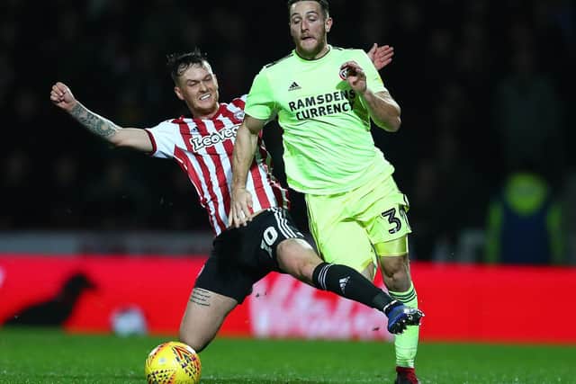 Conor Washington of Sheffield United is fouled by Josh McEachran of Brentford (Photo by Dan Istitene/Getty Images)