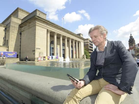 Author Neil Atkinson, who has created the Sheffield Blitz Heritage Trail app, outside the City Hall, which suffered bomb damage