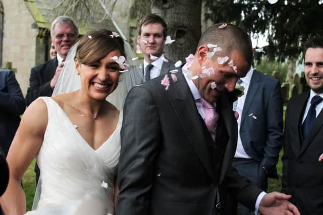 Olympic Gold medalist Jessica Ennis and Andy Hill are showered with confetti after they wedding at St Michael and All Angels Church, Hathersage, Derbyshire.Photo: Lynne Cameron/PA Wire