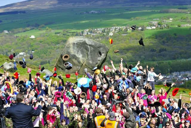 PICTURE BY Simon Wilkinson /SWPIX.COM... 12/05/2012 - Yorkshire Anthem On Ilkla Moor Baht' At - Hundreds of people and members of the Yorkshire Regiment gather on Ilkley Moor and Cow and Calf Rocks this morning ( sat ) to sing the song..see story - copyright picture - simon wilkinson - simon@swpix.com