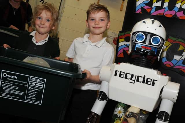 Jack Jerry and Roxy Bradley of St Martin's Primary School, Owston Ferry with a Recycler the recycling robot. Picture: Andrew Roe