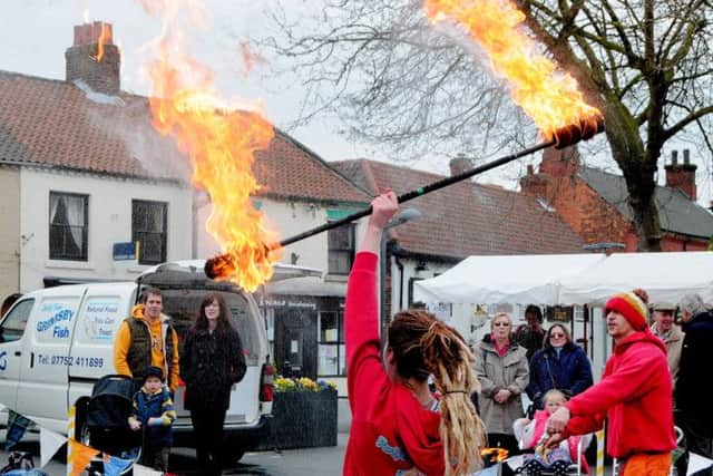 Circus Show in Crowle Market Place - pictured is Rebecca Henderson of Party Workshop, as part of their fire display.