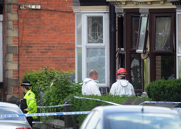 Forensic officers at the scene of the fire in Wake Road, Sheffield