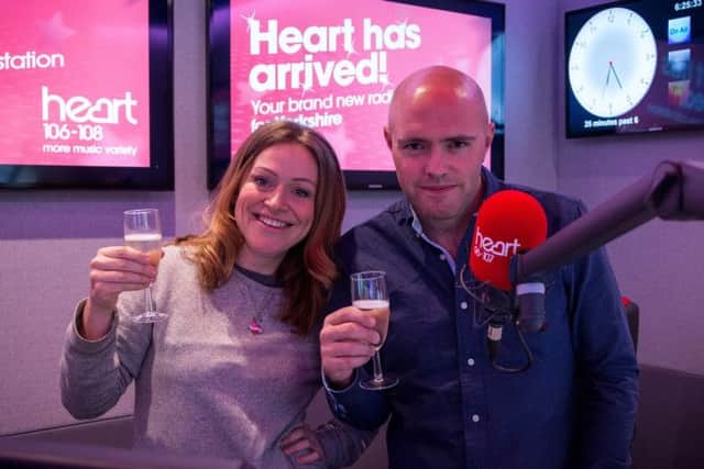 Cheers! Heart Yorkshire Breakfast presenters Emma Lenney and Dixie toast the launch of the new station.