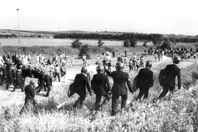 Police with riot gear move pickets at Orgreave Coking Plant during the 1984 miners' strike.