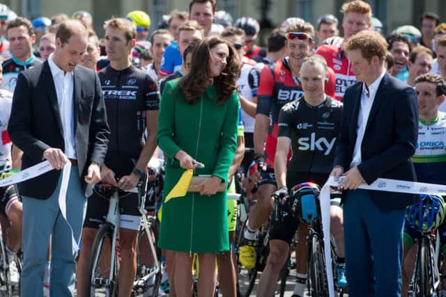 The Duke and Duchess of Cambridge, with Prince Harry, cut the ribbon to star The Tour de France Grand Depart at Harewood House, Leeds. Photo: Tim Ireland/PA Wire.