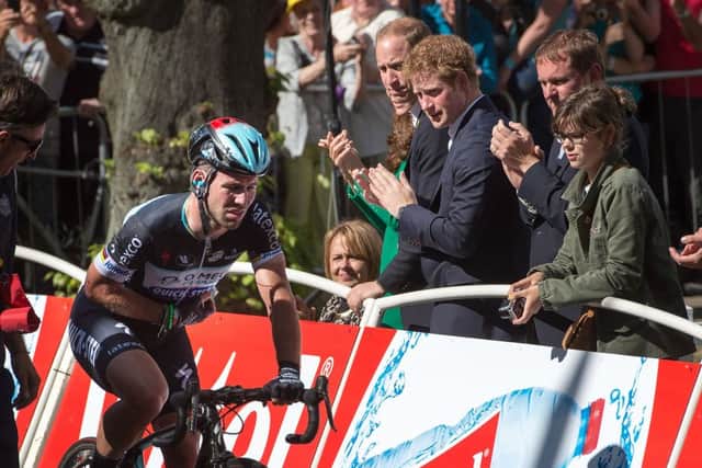 Omega Pharma-Quick Step Mark Cavendish rides over the finish line in Harrogate after crashing out of the final sprint, applauded by The Duke of Cambridge and Prince Harry at the end of stage one of the Tour de France in Harrogate, Yorkshire. PRESS ASSOCIATION Photo. See PA story CYCLING Tour. Picture date: Saturday July 5, 2014. Photo credit should read: Tim Ireland/PA Wire