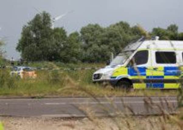 The scene on the A18 near Crowle where the body of a man has been found in the river.