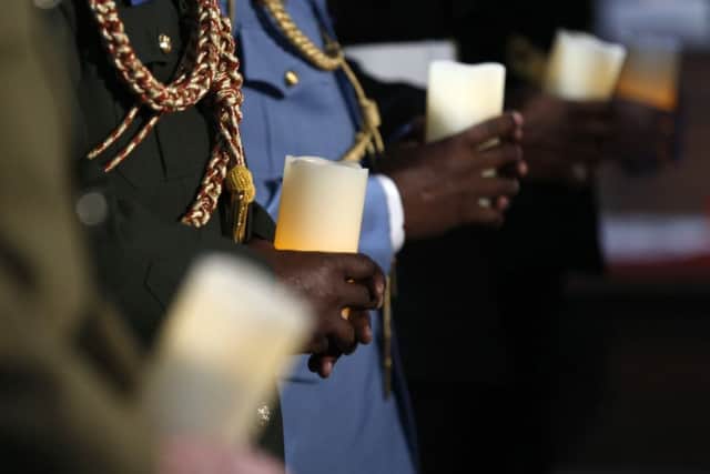 Military personnel hold candles  during a service for the Commonwealth to commemorate the 100th anniversary of the outbreak of World War One.