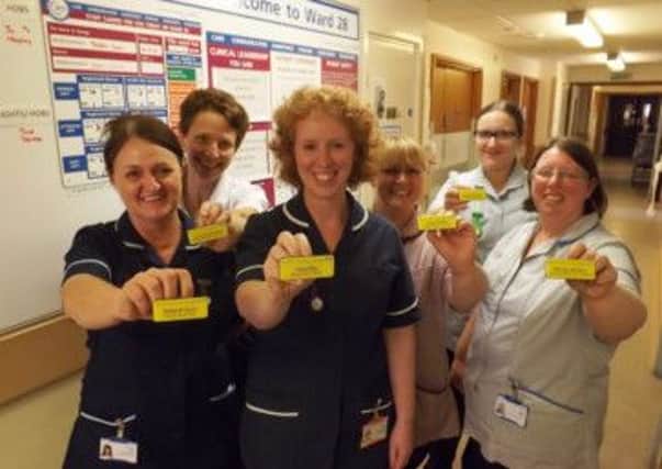 Staff proud of their new name badges (from left): Deborah Syron, deputy ward sister, Paula Broomhead, therapy manager acute/short term, Tara Filby, deputy chief nurse, Susan Shields, hospital support assistant, Hayley Colclough, senior healthcare assistant and Wendy Johnson, advanced healthcare assistant.