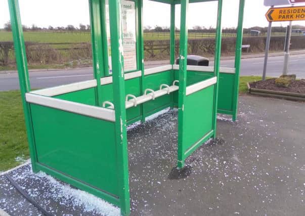 A vandalised bus shelter.