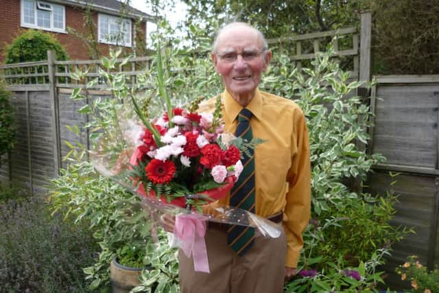 Derrick French, 93,  from Misterton with flowers he received following the 70th liberation celebration in Normandy.