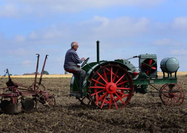 John Smith on his 1917 Overtime tractor prepares for the Festival of the Plough at his farm in low Burnham. Picture Scott Merrylees