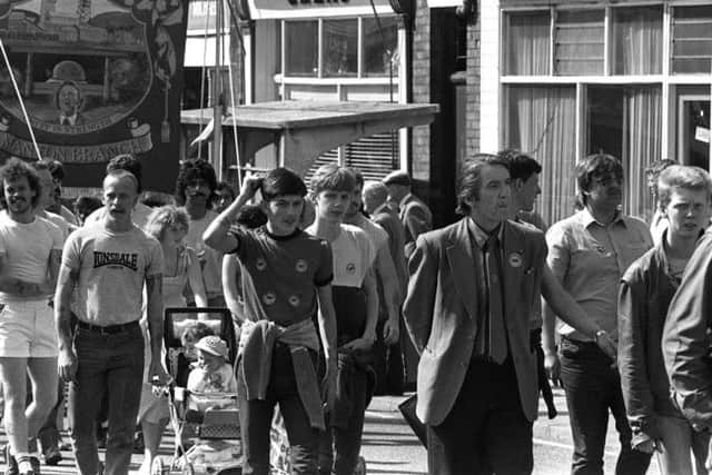 Miners Strike 28th  April 1984Miners and supporters march through Worksop.Pictured with the marchers is Dennis Skinner MP