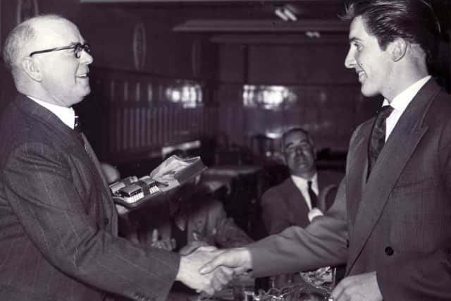 A gallant second in the Star Walk, 24 year old Dennis Skinner of Chesterfield, receives his prize from the Lord Mayor of Sheffield, Ald. J. Curtis, at a lunch at Davy's Cafe, Sheffield.
22nd May 1956