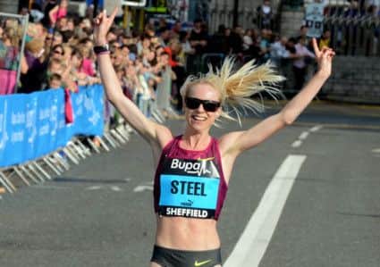 Great Yorkshire Run ladies' race winner Gemma Steel crosses the line in Sheffield on Sunday (28 September 2014).