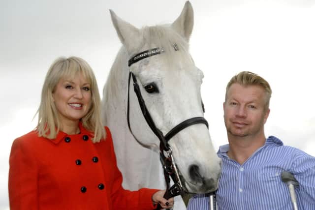 TV presenter Nicki Chapman with  Paralympian gold medalist Lee Pearson
taking part in the Spanish Riding School of Vienna at Sheffield Motorpoint Arena, from October 31 to November 2, 2014.