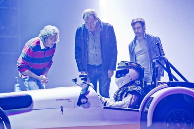 Clarkson, Hammond, May and the Stig will be returning in 2015 with their biggest ever stunt-studded Top Gear Live show. Photo: Alan Peebles