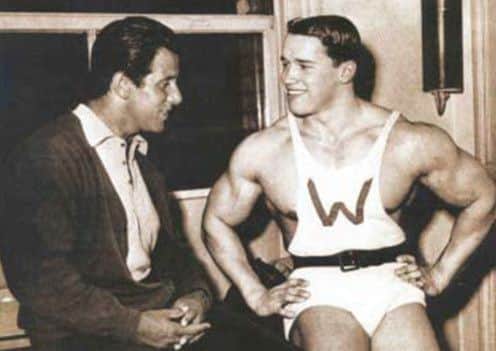 Reg Park chatting to a young Arnold Schwarzenegger