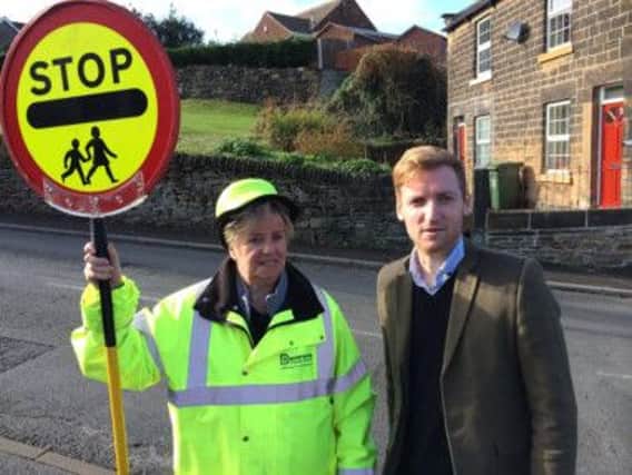 One of the county's under-threat lollipop ladies with Lee Rowley.