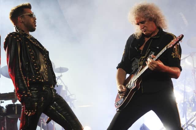 Queen will perform with Adam Lambert - pictured here, right, with the band's legendary guitarist Brian May