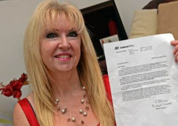 Yvonne Rufus with her letter from the cabinet office.