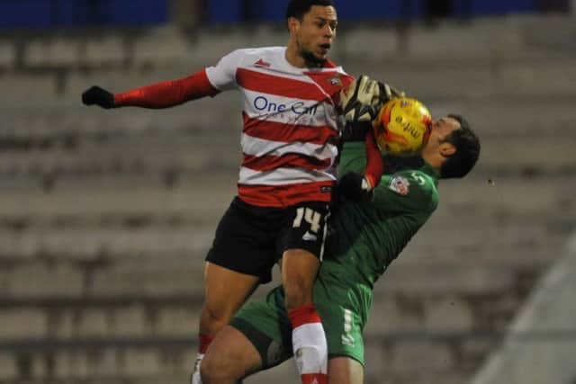 Oldham Ath v Doncaster Rovers Skybet League OneRovers nathan tyson challenges keeper paul rabchuka for goal after keeper spills ball