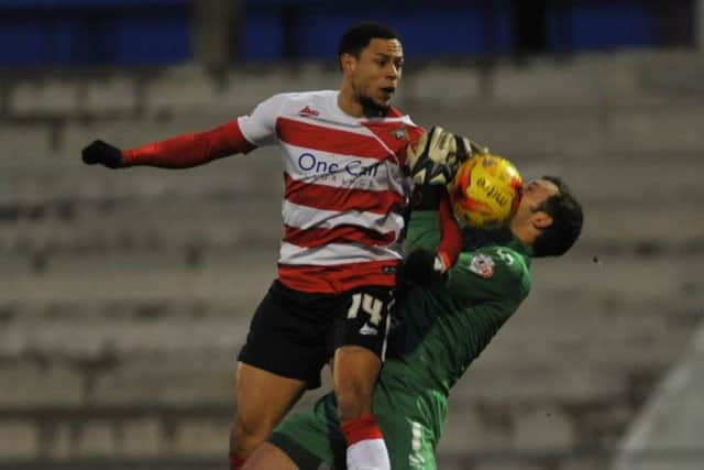 NSST 3-1-15 Oldham Ath v Doncaster Rovers Skybet League OneRovers nathan tyson challenges keeper paul rabchuka for goal after keeper spills ball