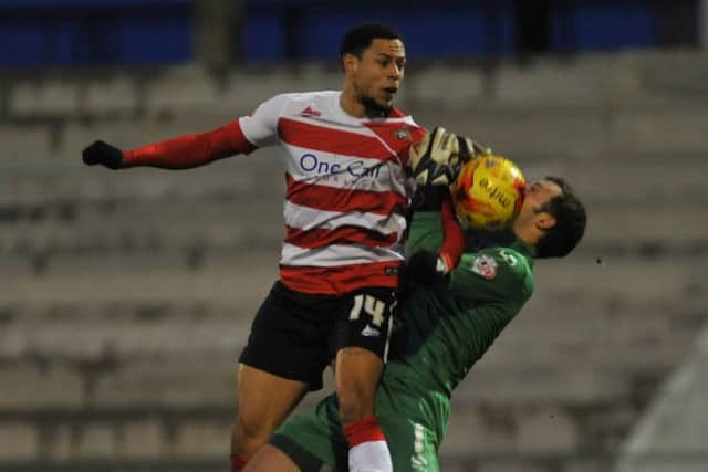 NSST 3-1-15 Oldham Ath v Doncaster Rovers Skybet League One

Rovers nathan tyson challenges keeper paul rabchuka for goal after keeper spills ball