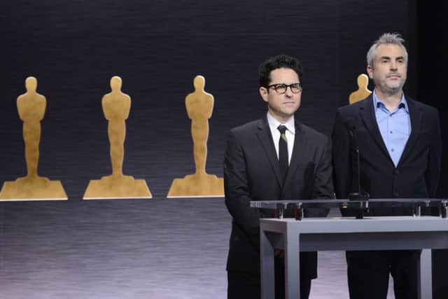J.J. Abrams, left, and Alfonso Cuaron announce the Academy Awards nominations at the 87th Academy Awards nomination ceremony