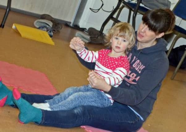 Emma Clark and her daughter Abby, two, have fun during the Mini Musical Monkeys toddler group at Belton Pavilion. Picture: Marie Caley NEPB 05-02-15 Music Monkeys MC 3