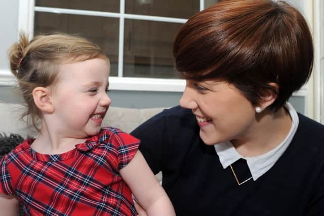 Holly Drewry with her daughter Isla Scholey, 17 months, after Holly received pioneering treatment for her MS at Royal Hallamshire Hospital and has now started walking again. Picture: Andrew Roe
