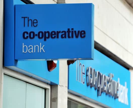 The Co-Operative Bank narrowed its losses last year
